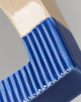 Tomar Buchstütze sand blau